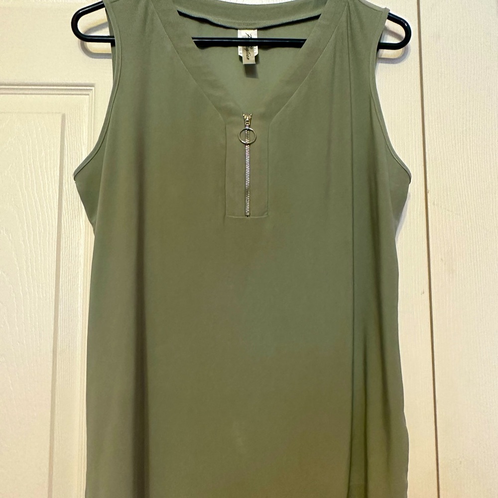 Sleeveless shirt with zipper front.